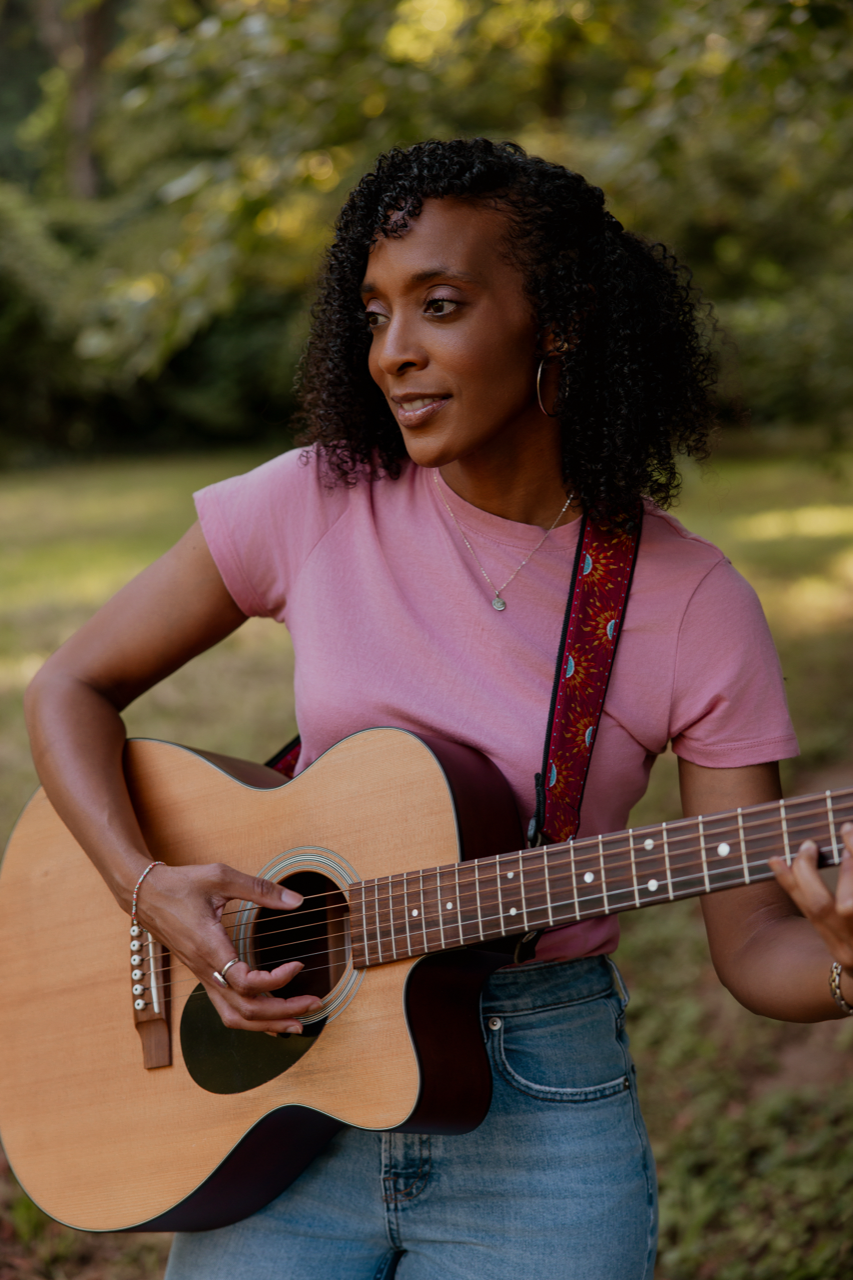 Courtney Ariel Bowden with her guitar